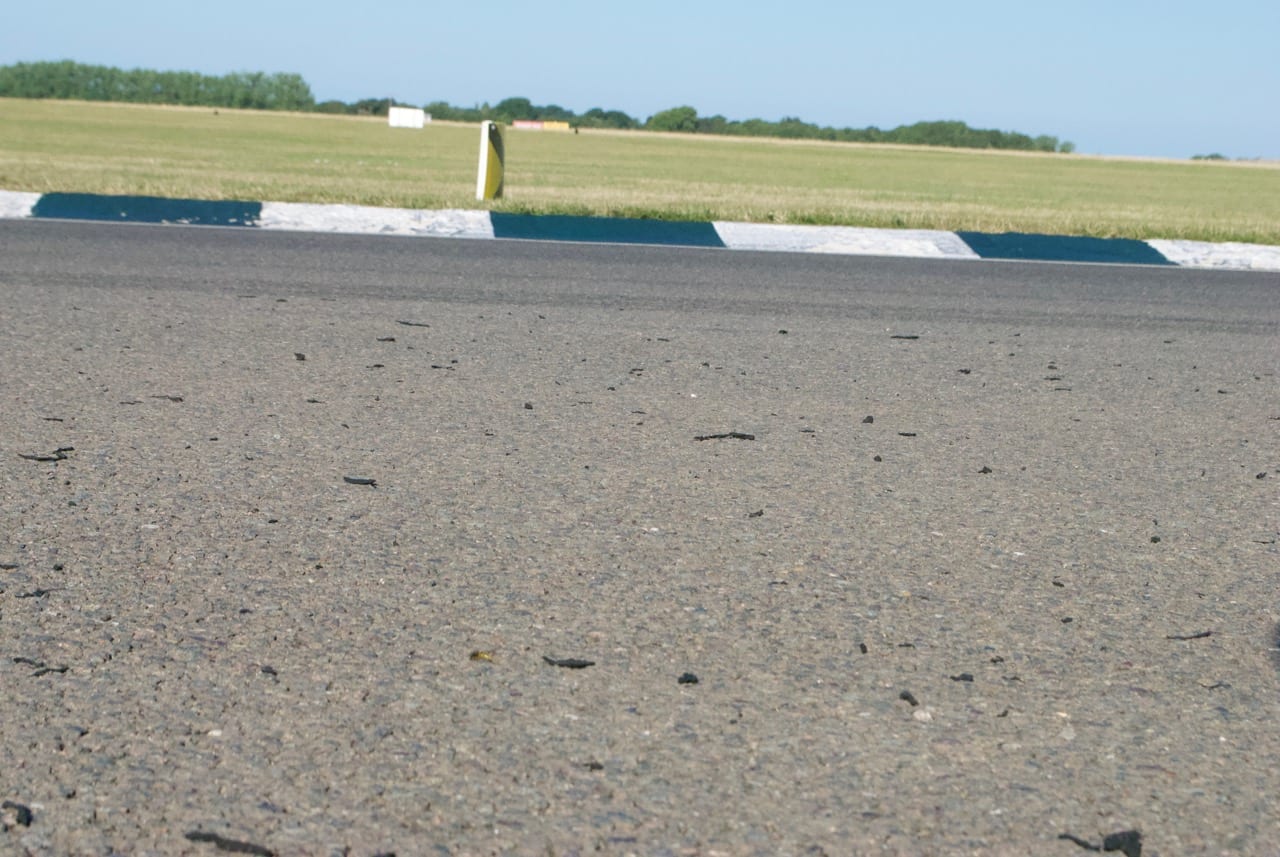 Shredded tyre on track at Woodcote, Goodwood circuit